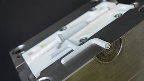 Leoni produces injection-moulded parts even more efficiently
